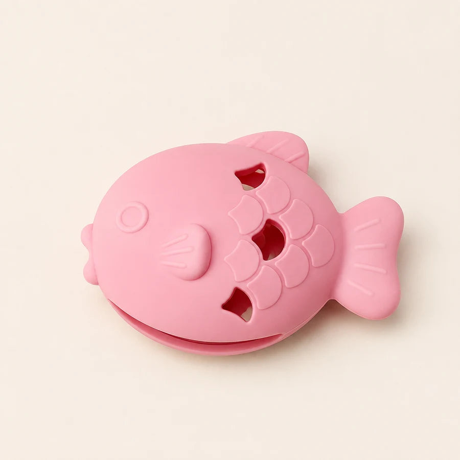 Pink PETEE Fishy Treat Pocket in a PETEE studio scene
