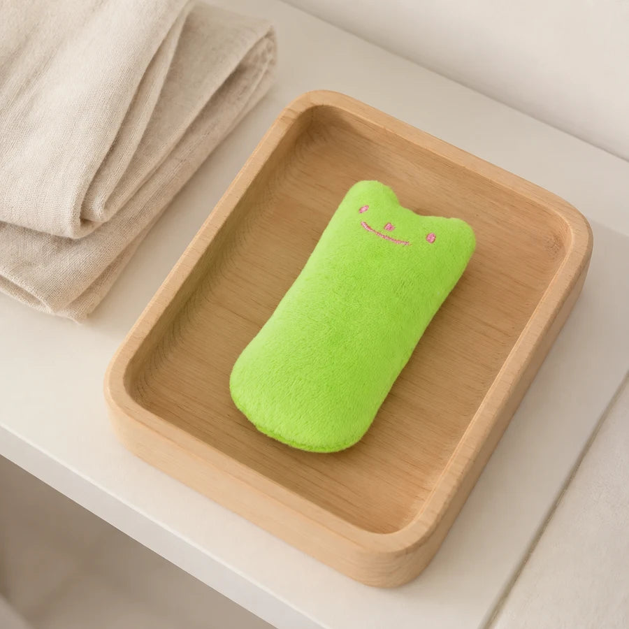 Green PETEE Mini Catnip Pillow in a PETEE storage context